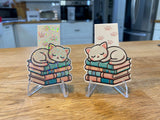 Sleeping kitty magnetic bookmark with cat napping on books