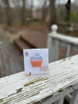 Cupcake bookmark marking a page