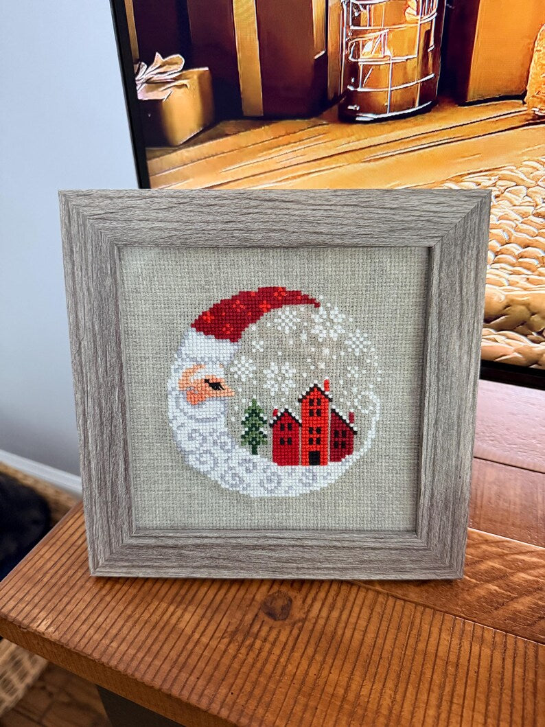 Framed cross-stitch — Santa Christmas Village, gray frame